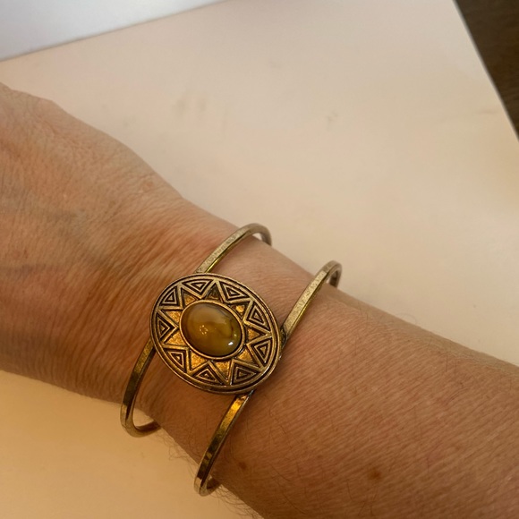 Jewelry - Brass cuff bracelet with yellow-gold stone insde sun image